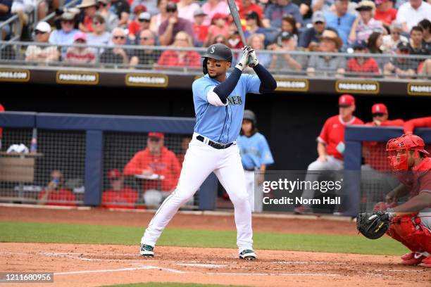 Carlos Gonzalez of the Seattle Mariners gets ready in the batters box against the Los Angeles Angels during a spring training game at Peoria Stadium...