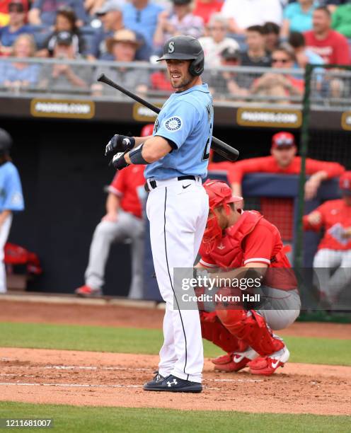 Tom Murphy of the Seattle Mariners gets ready to step into the batters box against the Los Angeles Angels during a spring training game at Peoria...