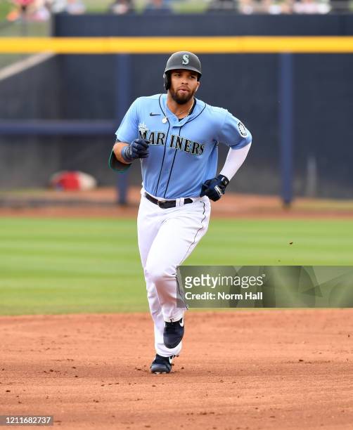 Jose Marmolejos of the Seattle Mariners rounds the bases after hitting a two run home run against the Los Angeles Angels during the second inning of...