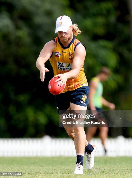 Daniel Rich kicks the ball during a Brisbane Lions AFL training session at the AFL Queensland headquarters Yeronga training fields on March 11, 2020...