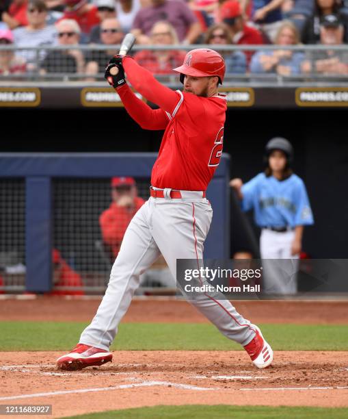Jared Walsh of the Los Angeles Angels follows through on a swing during a spring training game against the Seattle Mariners at Peoria Stadium on...
