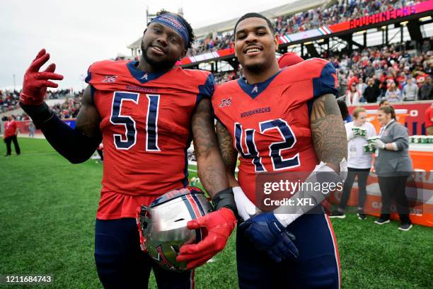 Edmond Robinson and Beniquez Brown of the Houston Roughnecks pose for a photo during the XFL game against the Seattle Dragons at TDECU Stadium on...