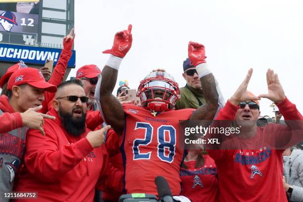 James Butler of the Houston Roughnecks celebrates with fans after a touchdown during the XFL game against the Seattle Dragons at TDECU Stadium on...