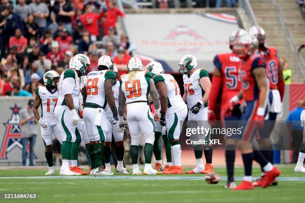 The Seattle Dragons huddle during the XFL game against the Houston Roughnecks at TDECU Stadium on March 7, 2020 in Houston, Texas.