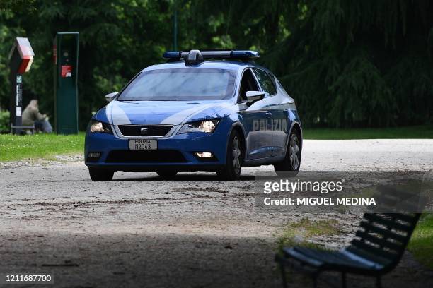 Police car patrols in the Parco Sempione park on May 4, 2020 in Milan as Italy starts to ease its lockdown, during the country's lockdown aimed at...