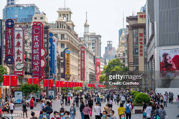 Many tourists visit and shop on Nanjing Road, Shanghai, China, May 2, 2020.-
