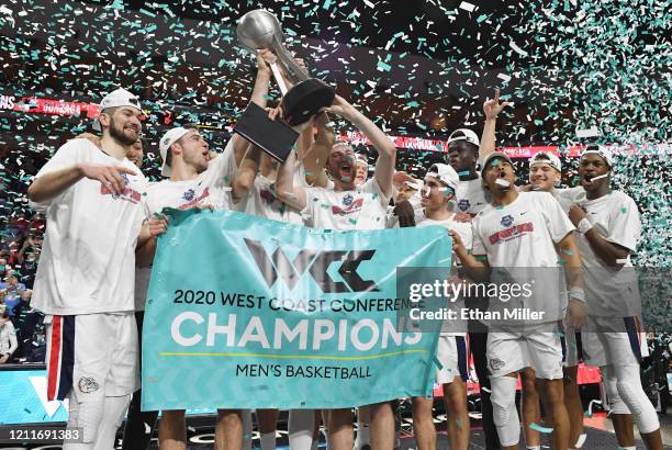 The Gonzaga Bulldogs celebrate with the trophy after defeating the Saint Mary's Gaels 84-66 to win the championship game of the West Coast Conference...