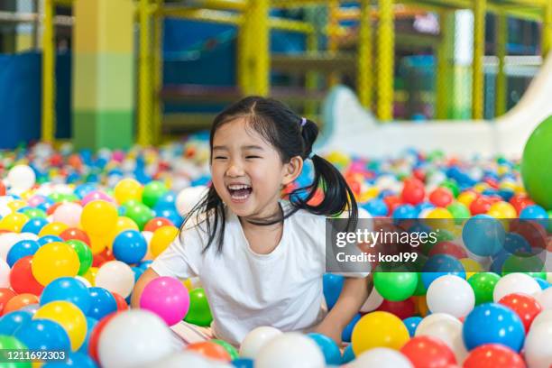 cute girl at the ball pool - ball pit stock pictures, royalty-free photos & images