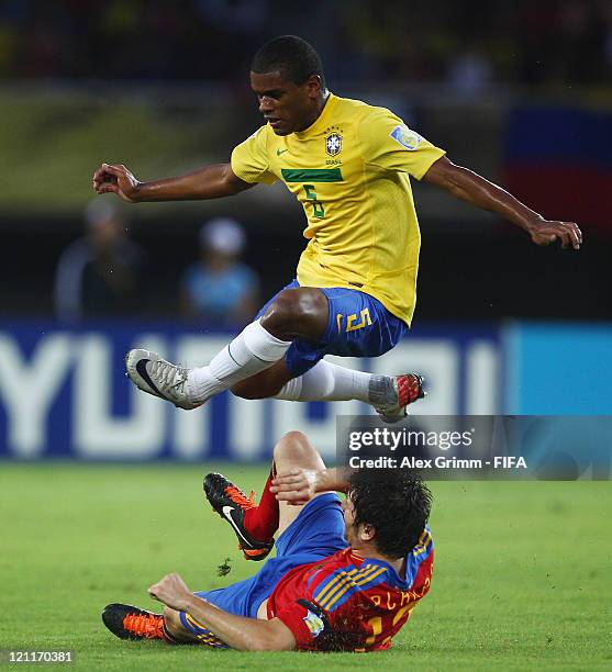 Fernando of Brazil is challenged by Carles Planas of Spain during the FIFA U-20 World Cup 2011 quarter final match between Brazil and Spain at...