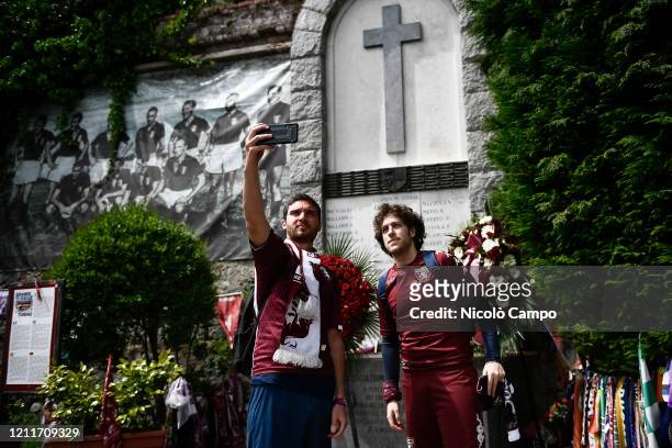 Fans of Torino FC take a picture in front of the monument dedicated to commemorate the Superga tragedy. On May 4 an airplane carrying the Grande...