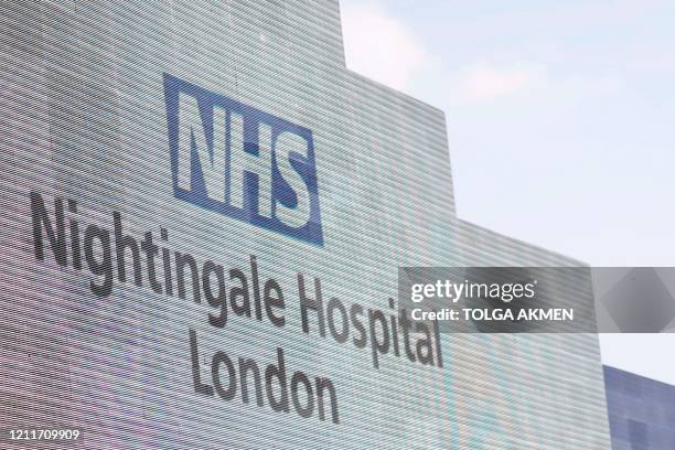 The sign is seen on the front of the NHS Nightingale Hospital London on May 4, 2020 set up at the ExCel London exhibition and convention centre to...