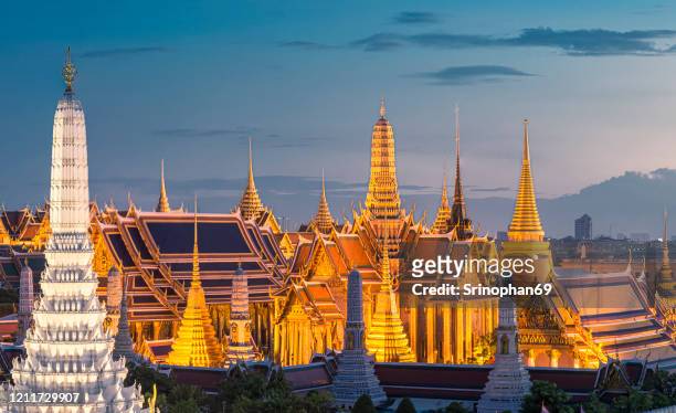 the beauty of the grand palace and phra kaew temple at sunset, bangkok, thailand the beautiful landmarks in asia temple of the emerald buddha - the emerald buddha temple in bangkok stock pictures, royalty-free photos & images
