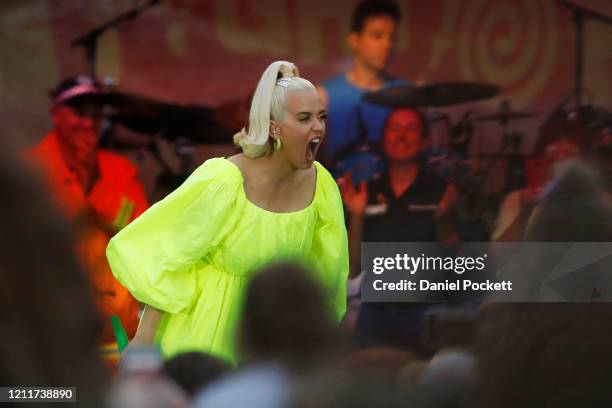 Katy Perry invites CFA representatives up on stage as she performs on March 11, 2020 in Bright, Australia. The free Fight On concert was held for for...