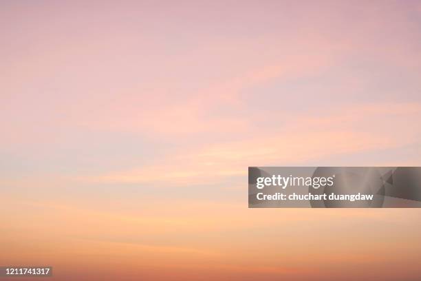 beautiful sky of pink clouds in sky at sunset springtime - orange sky stock-fotos und bilder