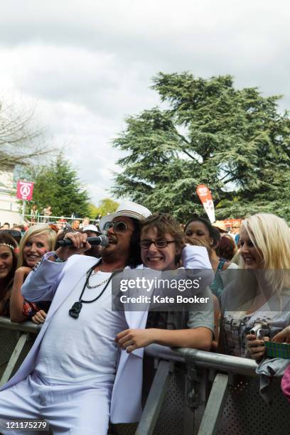 Miguel Mantovani of The Cuban Brothers mixes with the crowd during Summer Sundae Festival at De Montfort Hall And Gardens on August 14, 2011 in...