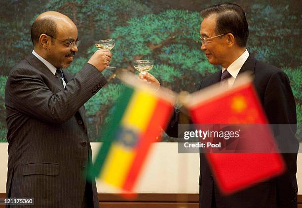 Chinese Premier Wen Jiabao toasts with Ethiopian Prime Minister Meles Zenawi at the Great Hall of the People meet on August 15, 2011 in Beijing,...