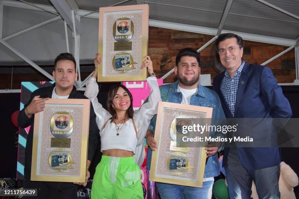 Pablo Preciado, Melissa Robles and Roman Torres of Matisse band, and Robert Lopez director of Sony Music pose for a photo with awards for its high...