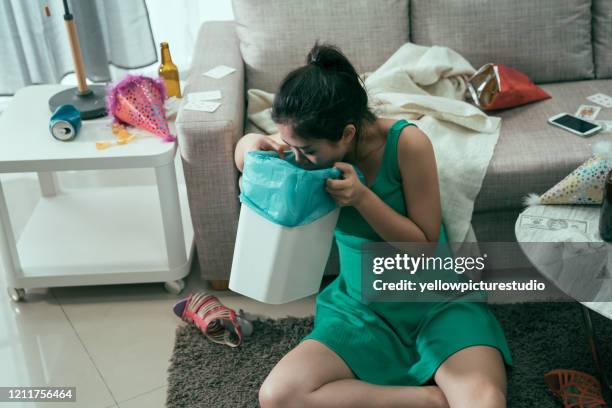 asian woman in dress in alcoholic intoxication. - throw up stock pictures, royalty-free photos & images