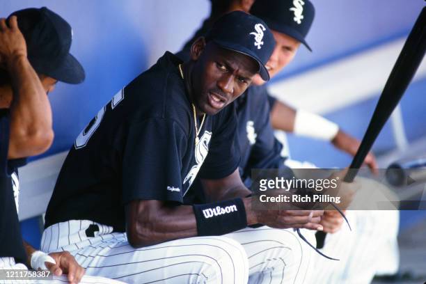 Michael Jordan of the Chicago White Sox looks on from the dugout during a spring training game at Ed Smith Stadium in 1994 in Sarasota, Florida.