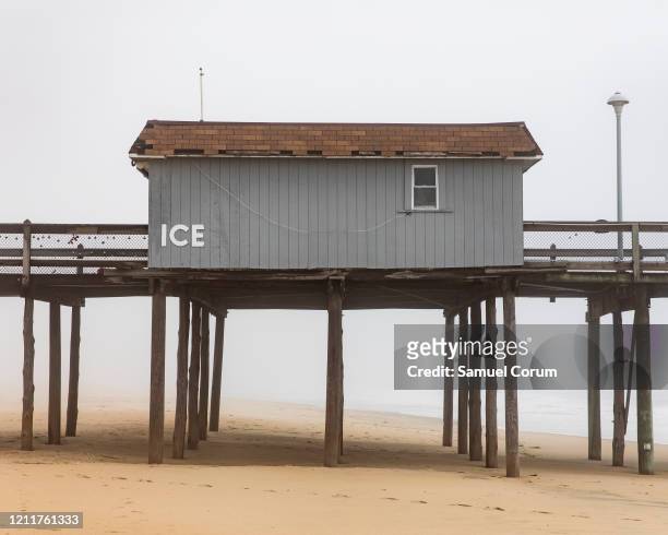 The shack on the fishing pier remains closed in the fog on April 26, 2020 in Ocean City, Maryland. The coronavirus pandemic shut down the city just...