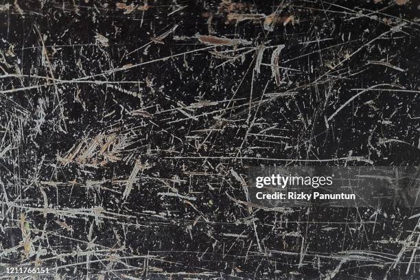 full frame of texture of the old black metal plate - scratched stockfoto's en -beelden