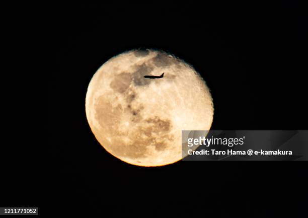 the flying airplane and moon in kanagawa prefecture of japan - moon landing foto e immagini stock