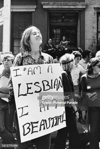 Christopher Street Liberation Day: a woman holds a large sign that reads 'I am a lesbian and I am beautiful' during the first Stonewall anniversary...