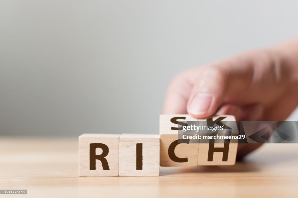 Rich Requires Risk Risk Or Rich Concept Hand Flip Wood Cube Change The Word High-Res Stock ...