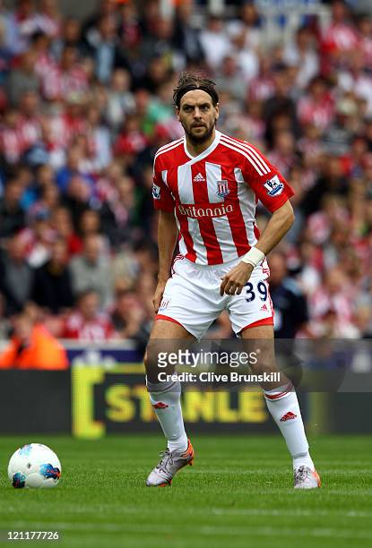 Jonathan Woodgate of Stoke controls the ball during the Barclays Premier League match between Stoke City and Chelsea at the Britannia Stadium on...