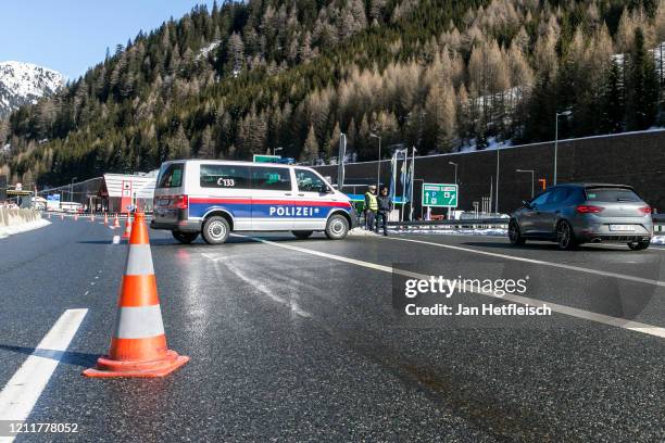 Austrian border police redirect cars arriving from Italy from the highway to the checkpoint at the Brenner Pass border crossing on March 11, 2020...