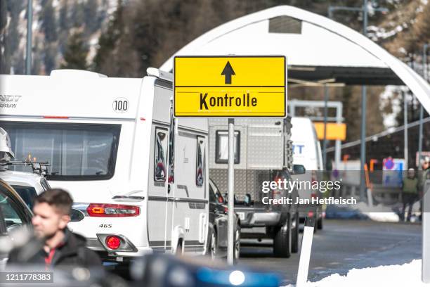 Austrian border police stop cars arriving from Italy for a health and temperature check at the Brenner Pass border crossing on March 11, 2020 near...