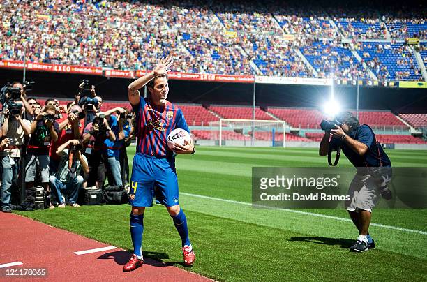 Cesc Fabregas gestures during his presentation as the new signing for FC Barcelona at Camp Nou sports complex on August 15, 2011 in Barcelona, Spain.
