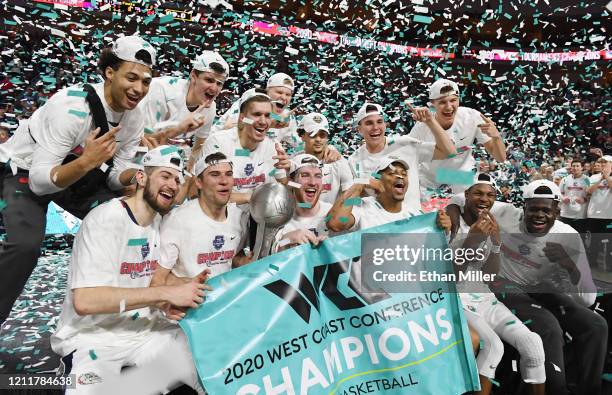 The Gonzaga Bulldogs celebrate with the trophy after defeating the Saint Mary's Gaels 84-66 to win the championship game of the West Coast Conference...