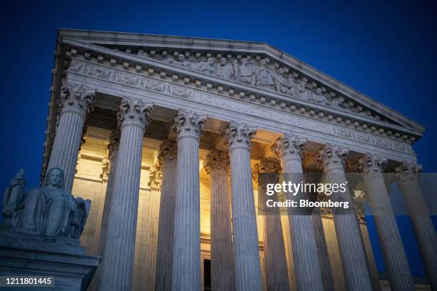 The U.S. Supreme Court stands illuminated at night in Washington, D.C., U.S., on Monday, May 4, 2020. Lawmakers are preparing for a debate on whether...