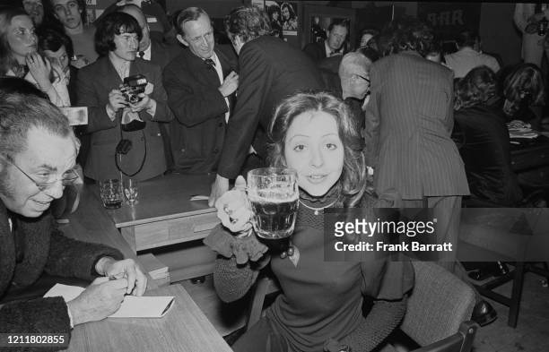 Greek singer Vicky Leandros celebrates her win with a pint of beer the day after the Eurovision Song Contest, Edinburgh, UK, 26th March 1972;...