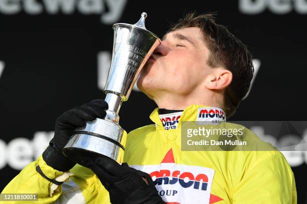 Harry Skelton celebrates winning the Betway Queen Mother Champion Chase after riding Politologue at Cheltenham Racecourse on March 11, 2020 in...
