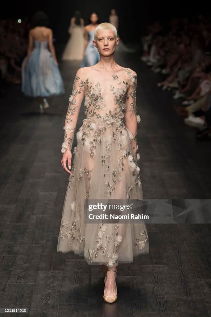 Sean Rentero A model walks the runway in designs by Paolo Sebastian during Runway ...