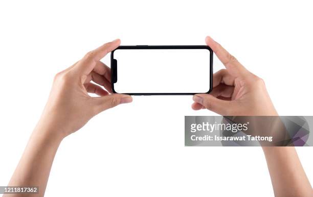 smartphone in female hands taking photo isolated on white background - composizione orizzontale foto e immagini stock