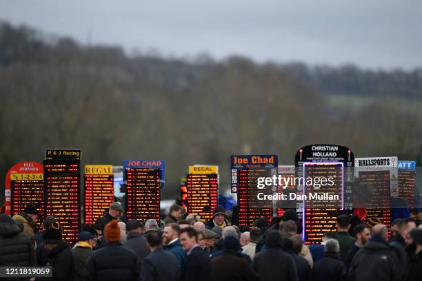 Electronic bookmakers boards are seen at Cheltenham Racecourse on March 11, 2020 in Cheltenham, England.