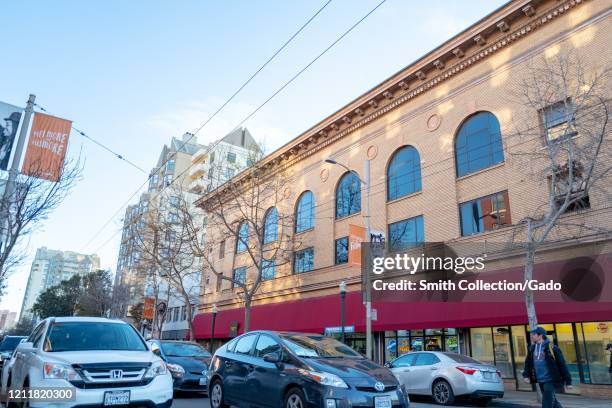 Pedestrians, cars and buildings are visible in the Fillmore District, San Francisco, California, March 7, 2020.