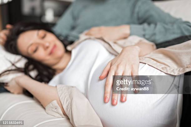 pregnant woman - baby kicking stock pictures, royalty-free photos & images
