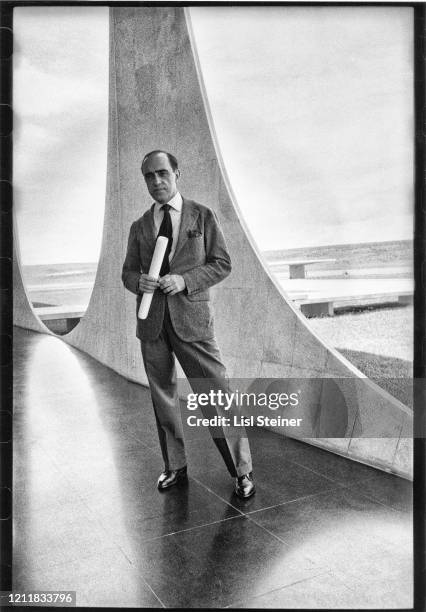 Portrait of Brazilian architect Oscar Niemeyer as he stand in the Palacio da Alvorada , Brasilia, Brazil, 1957.