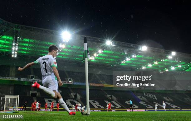 General view of the empty stadium as Patrick Herrmann of Borussia Monchengladbach takes a corner during the Bundesliga match between Borussia...