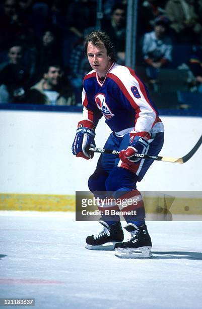 Randy Carlyle of the Winnipeg Jets skates on the ice during an NHL game against the New York Islanders circa 1987 at the Nassau Coliseum in...