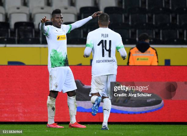 Breel Embolo of Borussia Monchengladbach celebrates his sides second goal with Alassane Plea after a 1. FC Koeln own by Jorge Mere of 1. FC Koeln...
