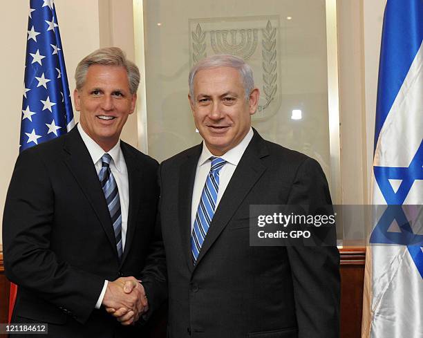 In this handout image provided by the Israeli Government Press Office , Israeli Prime Minister Benjamin Netanyahu shakes hands with US Congressman...