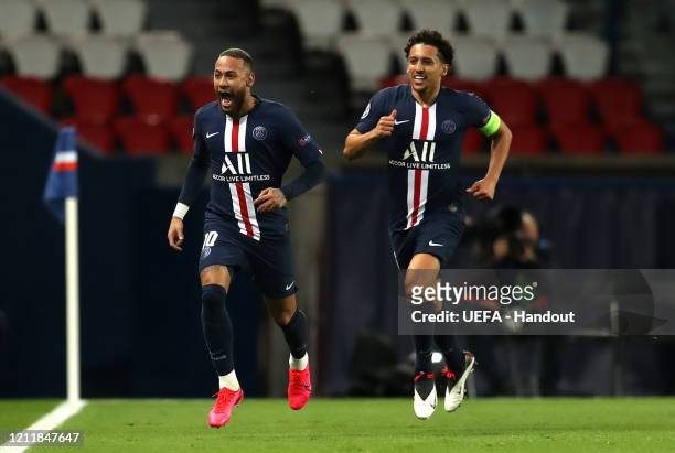 In this handout image provided by UEFA, Neymar of Paris Saint-Germain celebrates with Marquinhos after scoring his team's first goal during the UEFA...