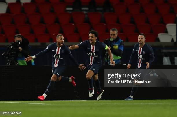 In this handout image provided by UEFA, Neymar of Paris Saint-Germain celebrates with Marquinhos after scoring his team's first goal during the UEFA...