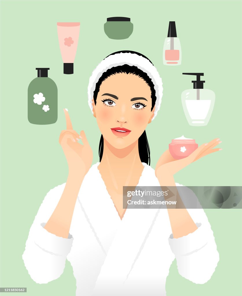 Young woman applying a beauty product