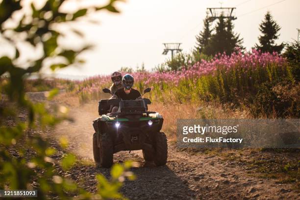 quad bike mountain exploration - off road vehicle stock pictures, royalty-free photos & images